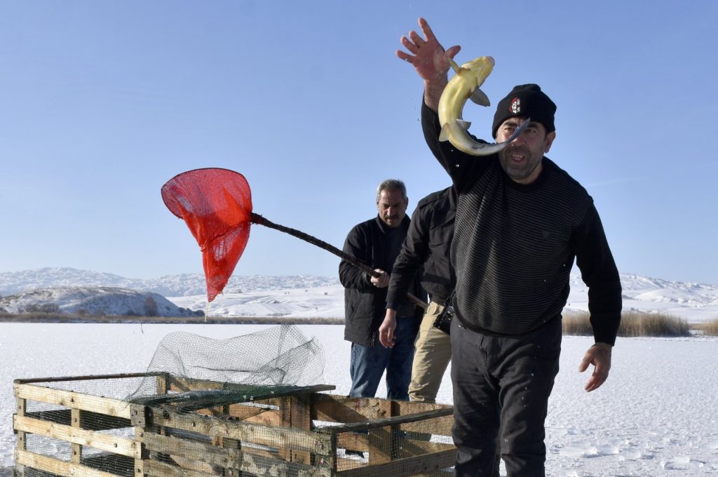 Turkish lakes freeze over, locals revive Eskimo-style ice fishing